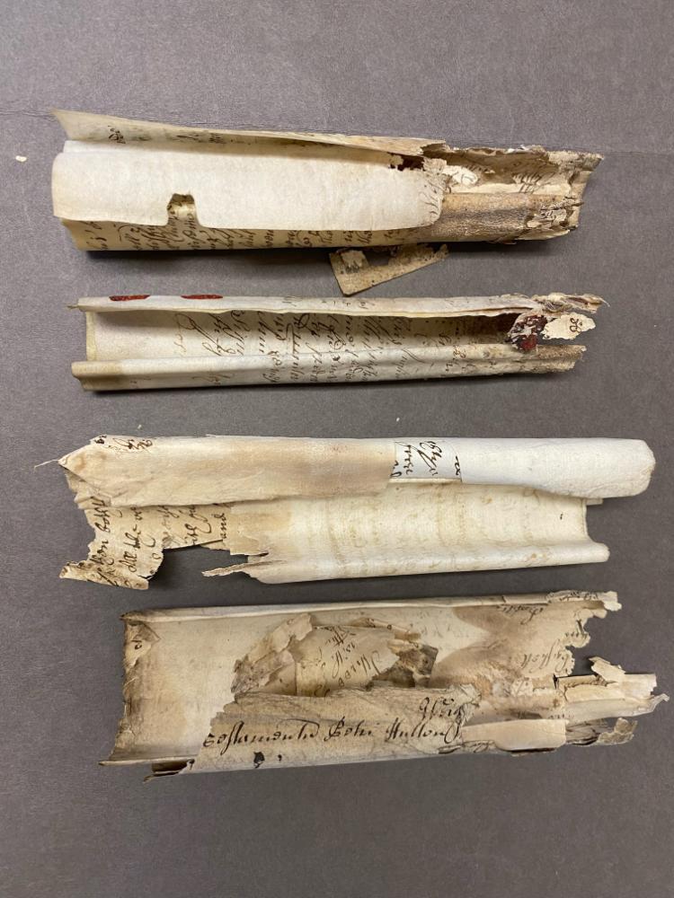 Damaged probate bundles ready for conservation work